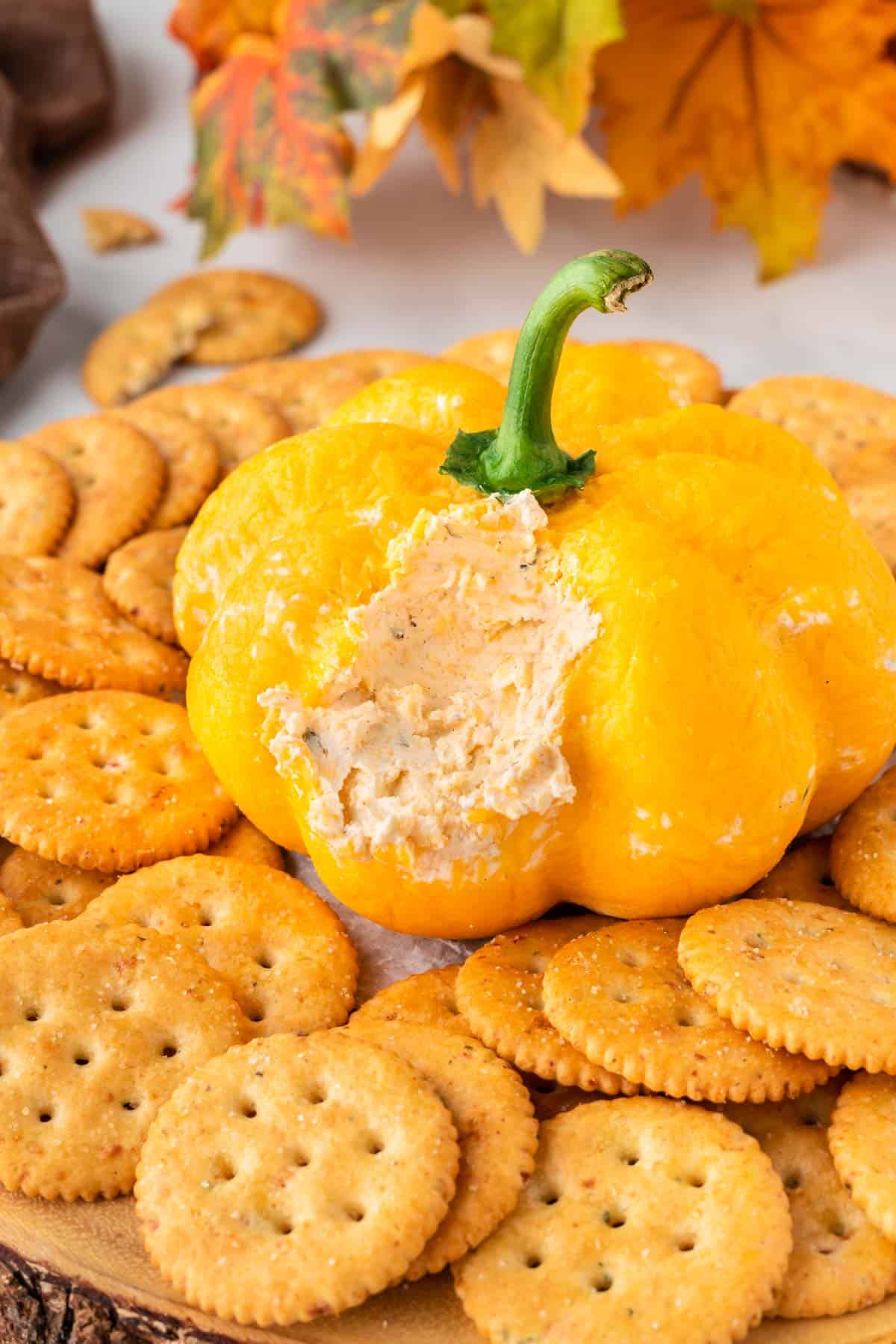 cheese ball cut open to show the creamy cheese dip filling