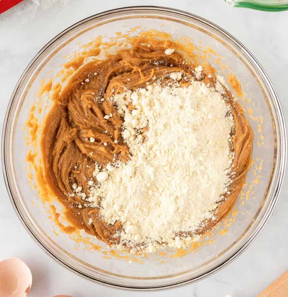 adding cake mix to the peanut butter batter