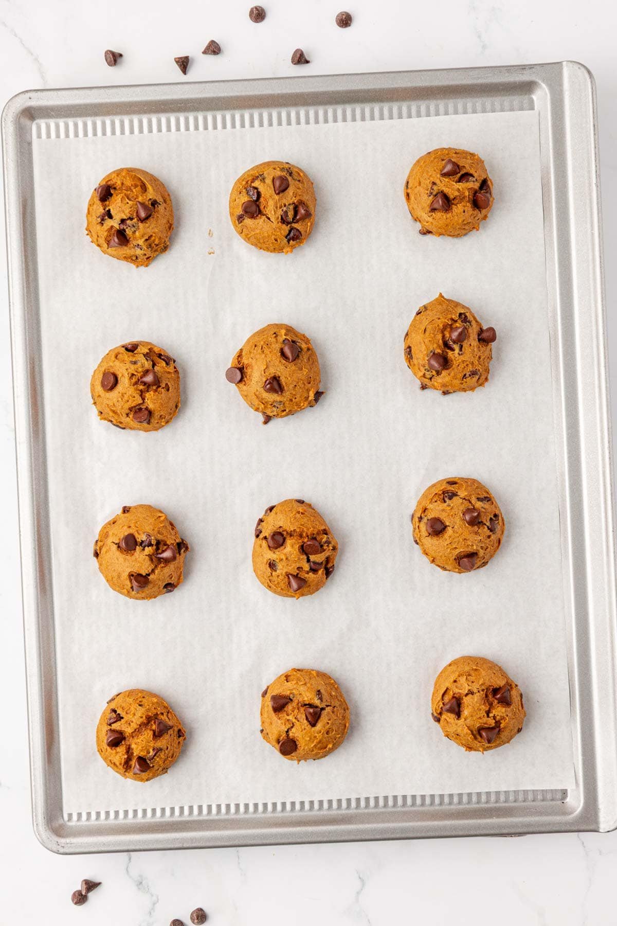 cake mix pumpkin cookies on a baking sheet