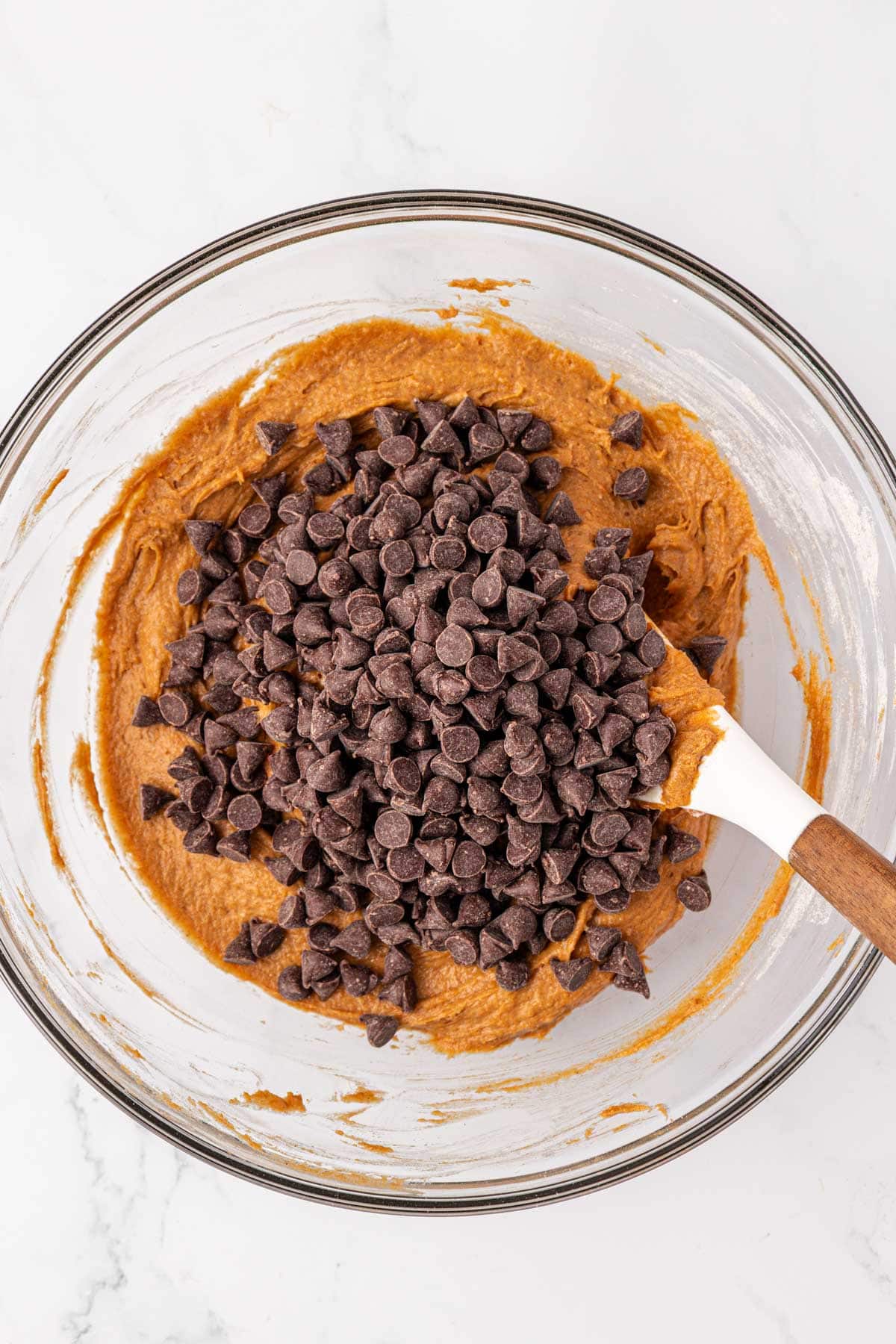 adding the chocolate chips to the batter