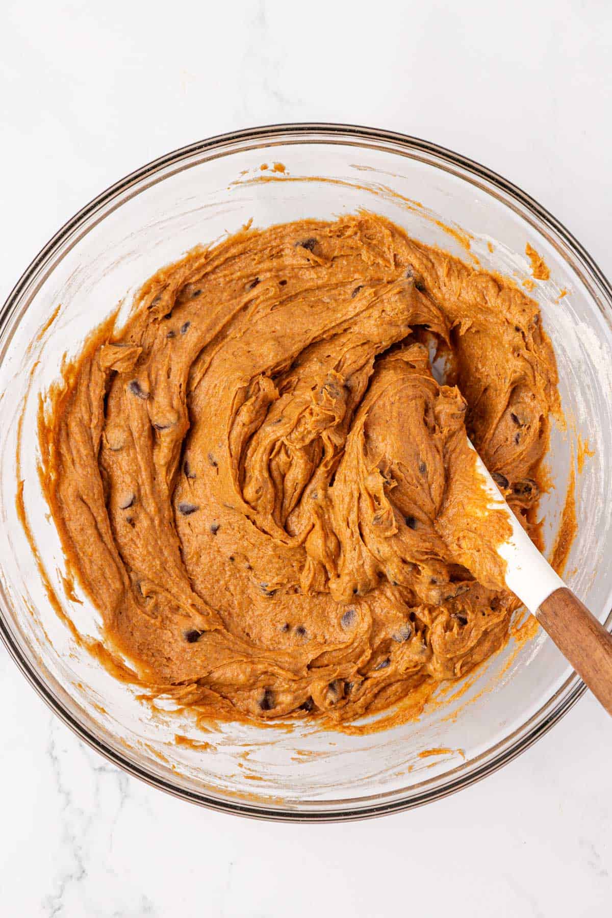 cake mix pumpkin chocolate chip cookie batter mixed together