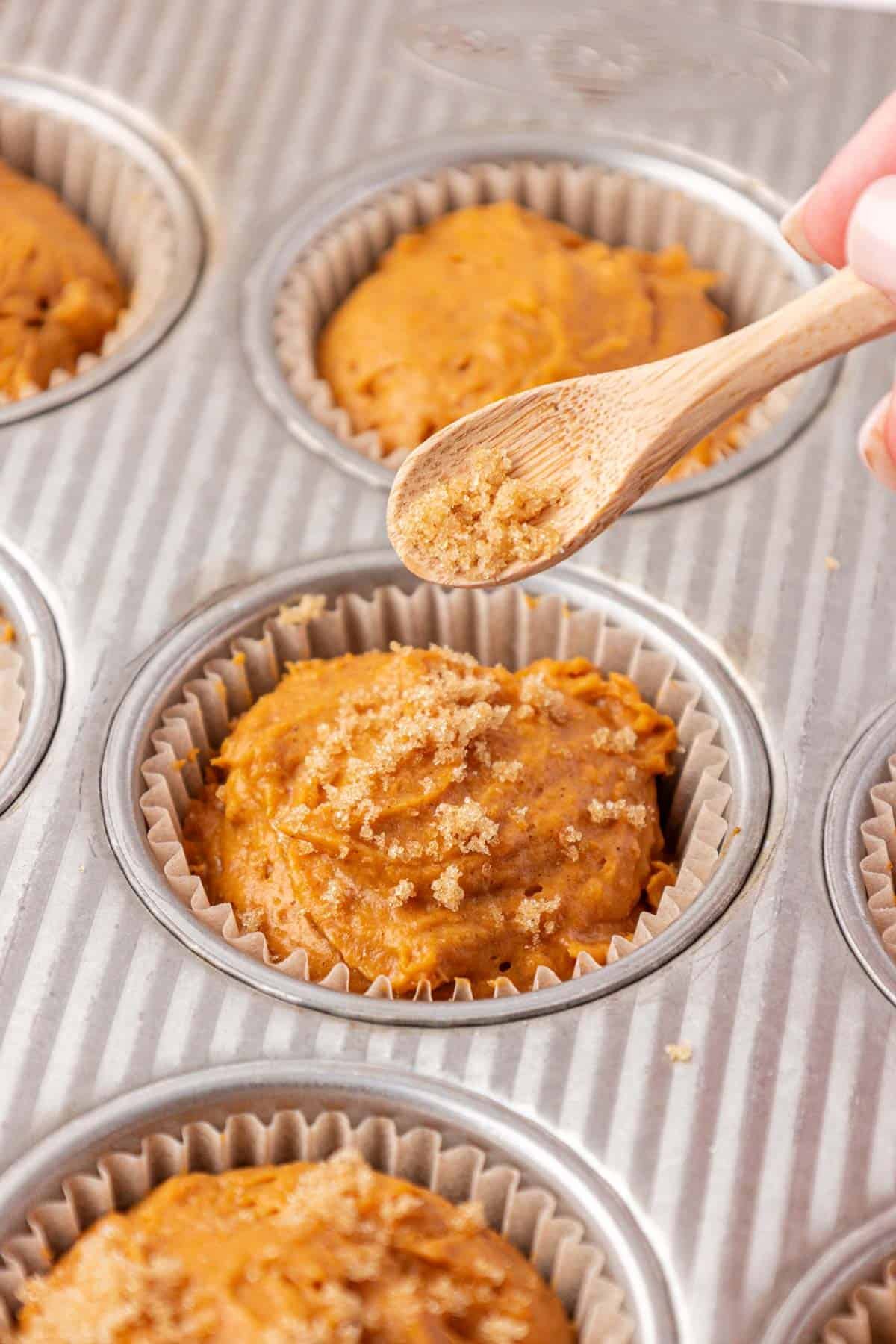 adding brown sugar on top of the muffin batter