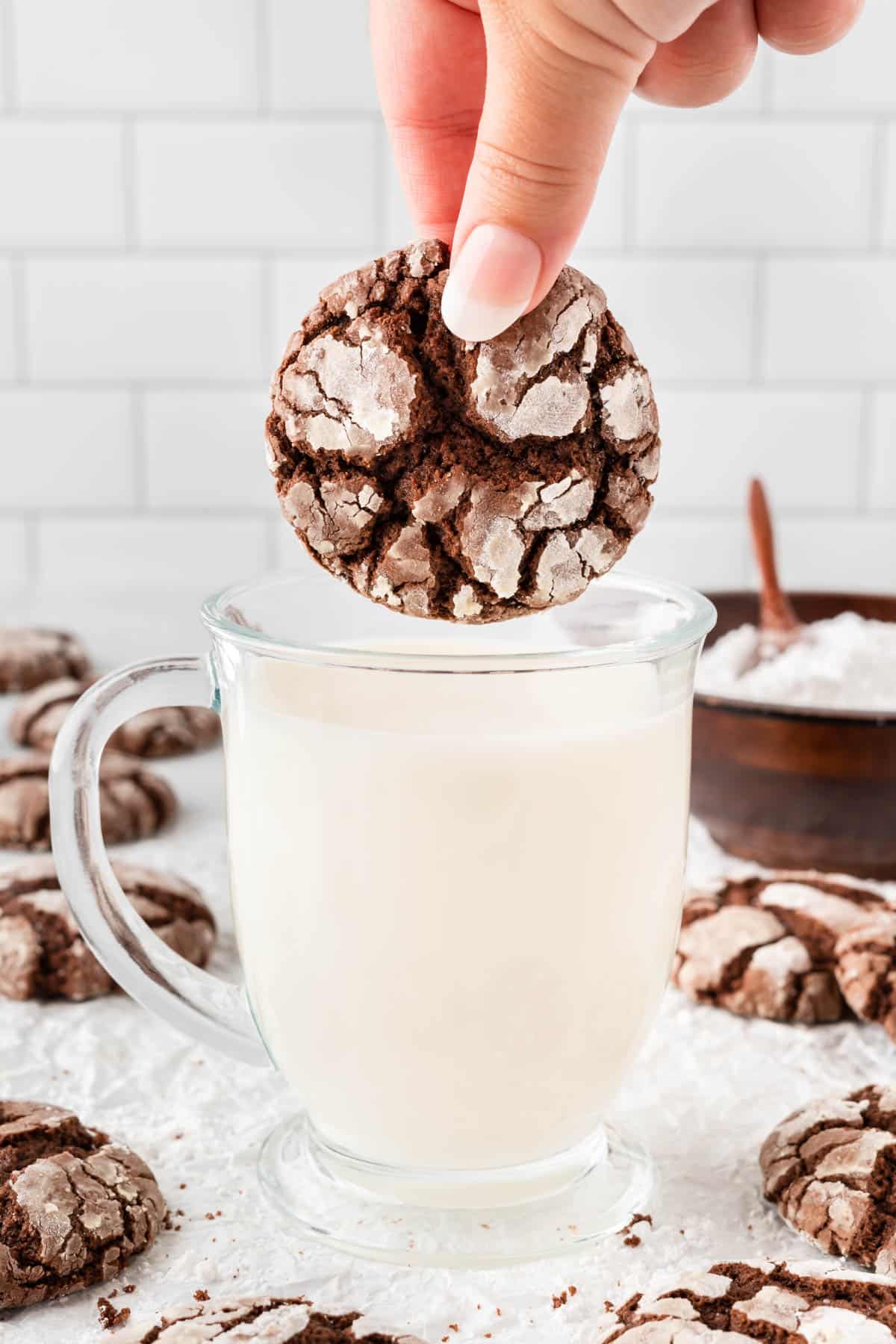 dipping a cookie in milk