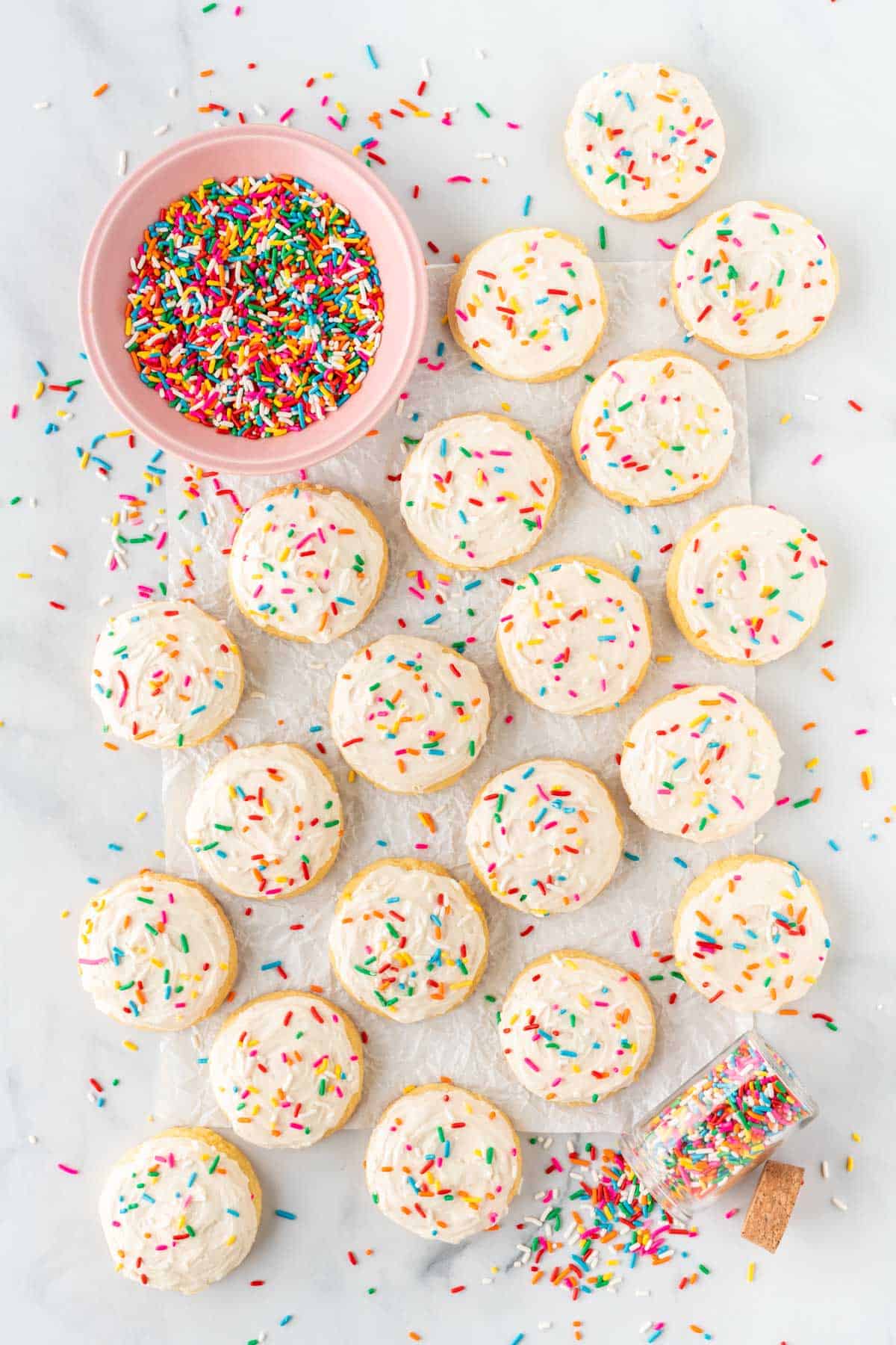 cake mix sugar cookies topped with frosting and sprinkles