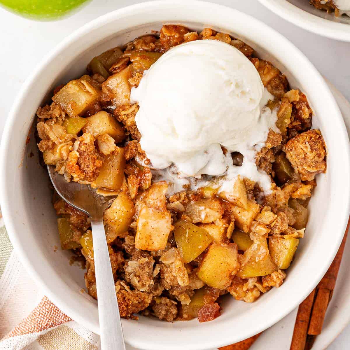 Delicious Gluten-Free Apple Crisp 19 Gluten-free apple crisp topped with a scoop of vanilla ice cream for the recipe card thumbnail