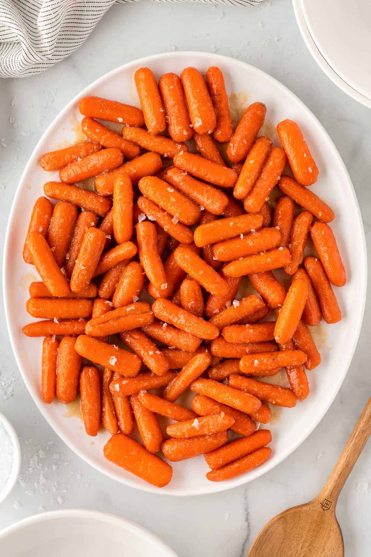 honey brown sugar glazed carrots on a serving platter