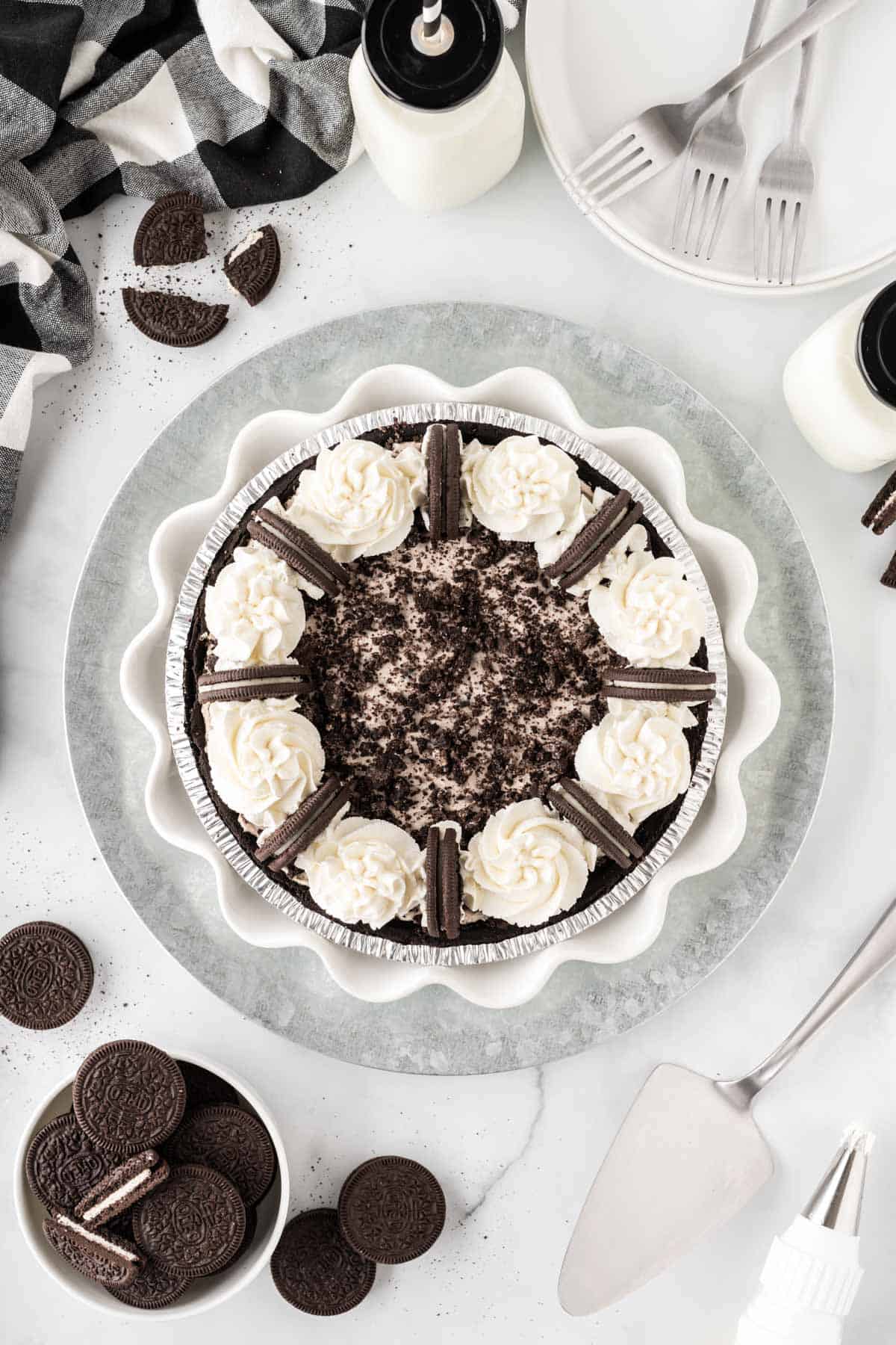 oreo pie decorated with whipped cream and whole oreos