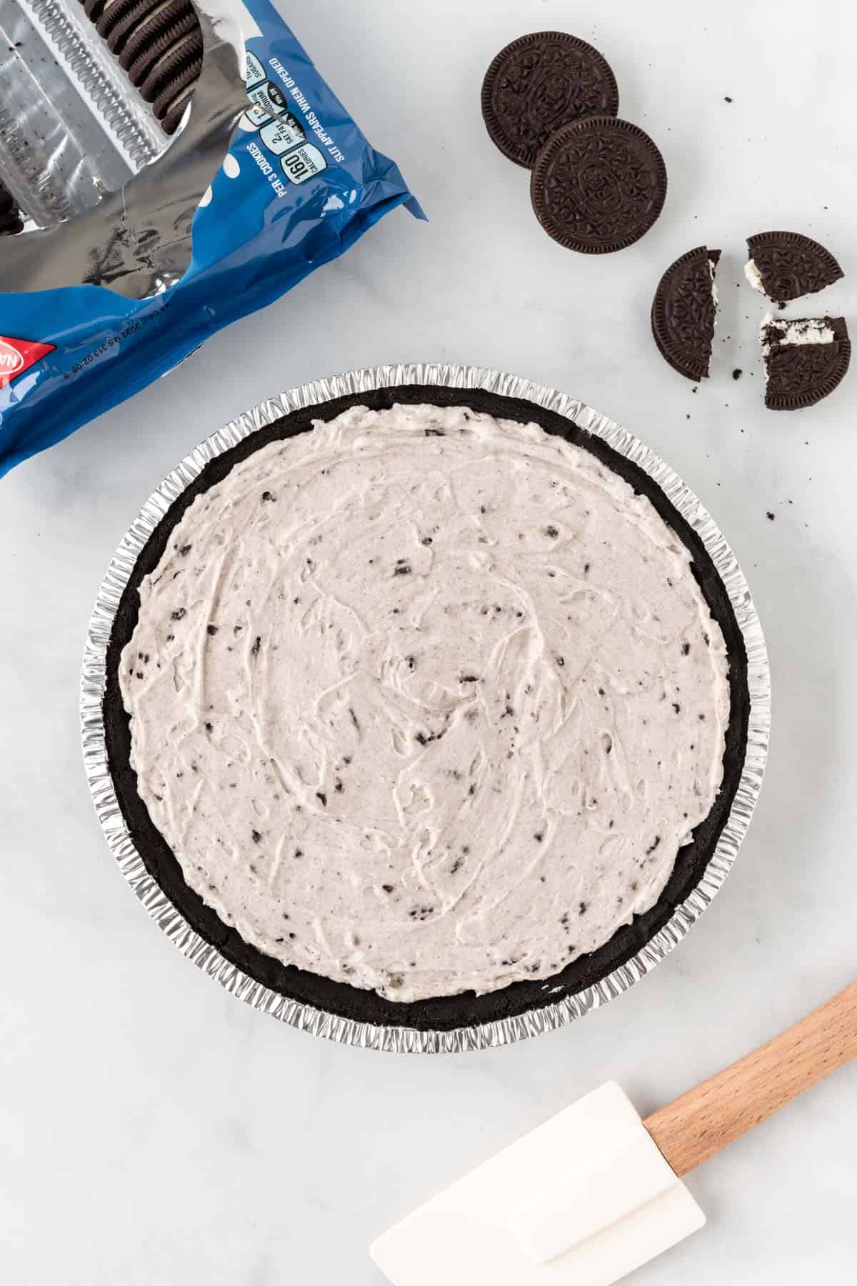 oreo pie filling smoothed out in an oreo pie crust