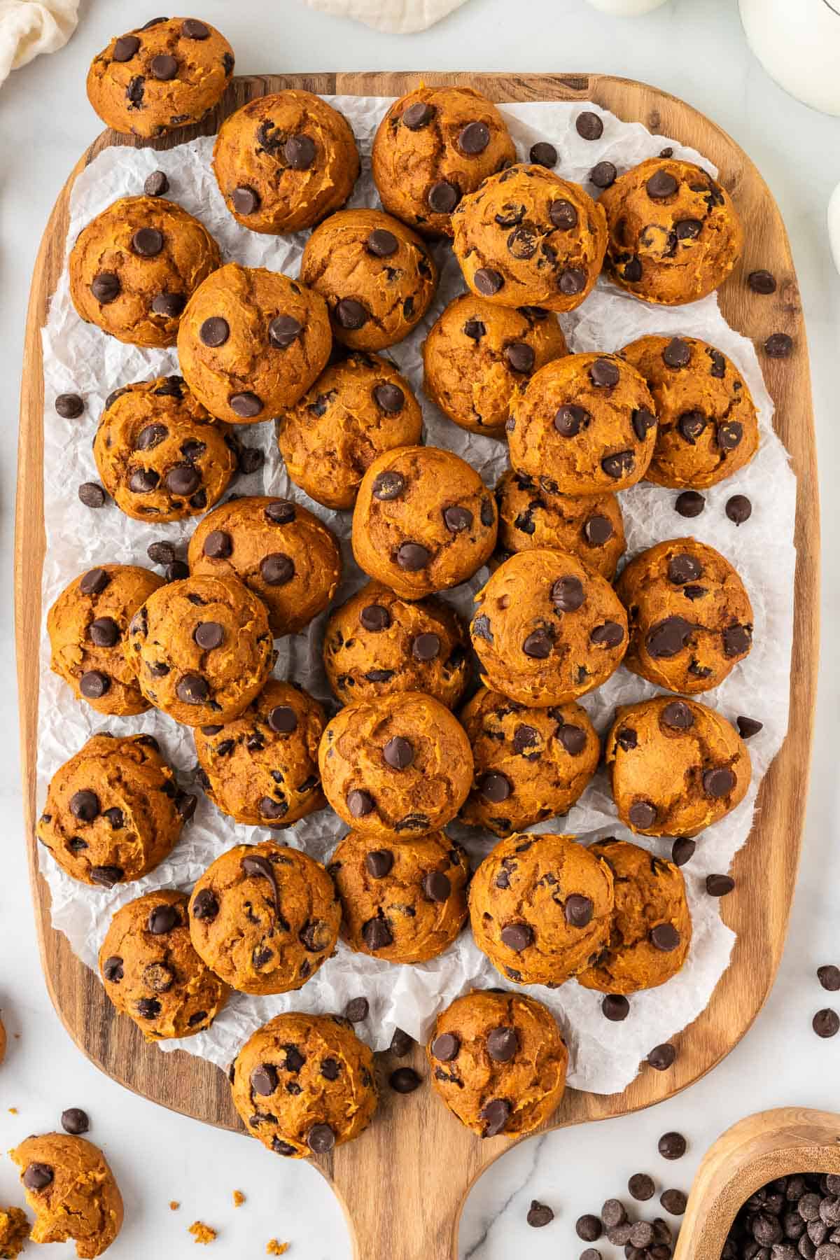 cake mix pumpkin cookies on a wooden cutting board