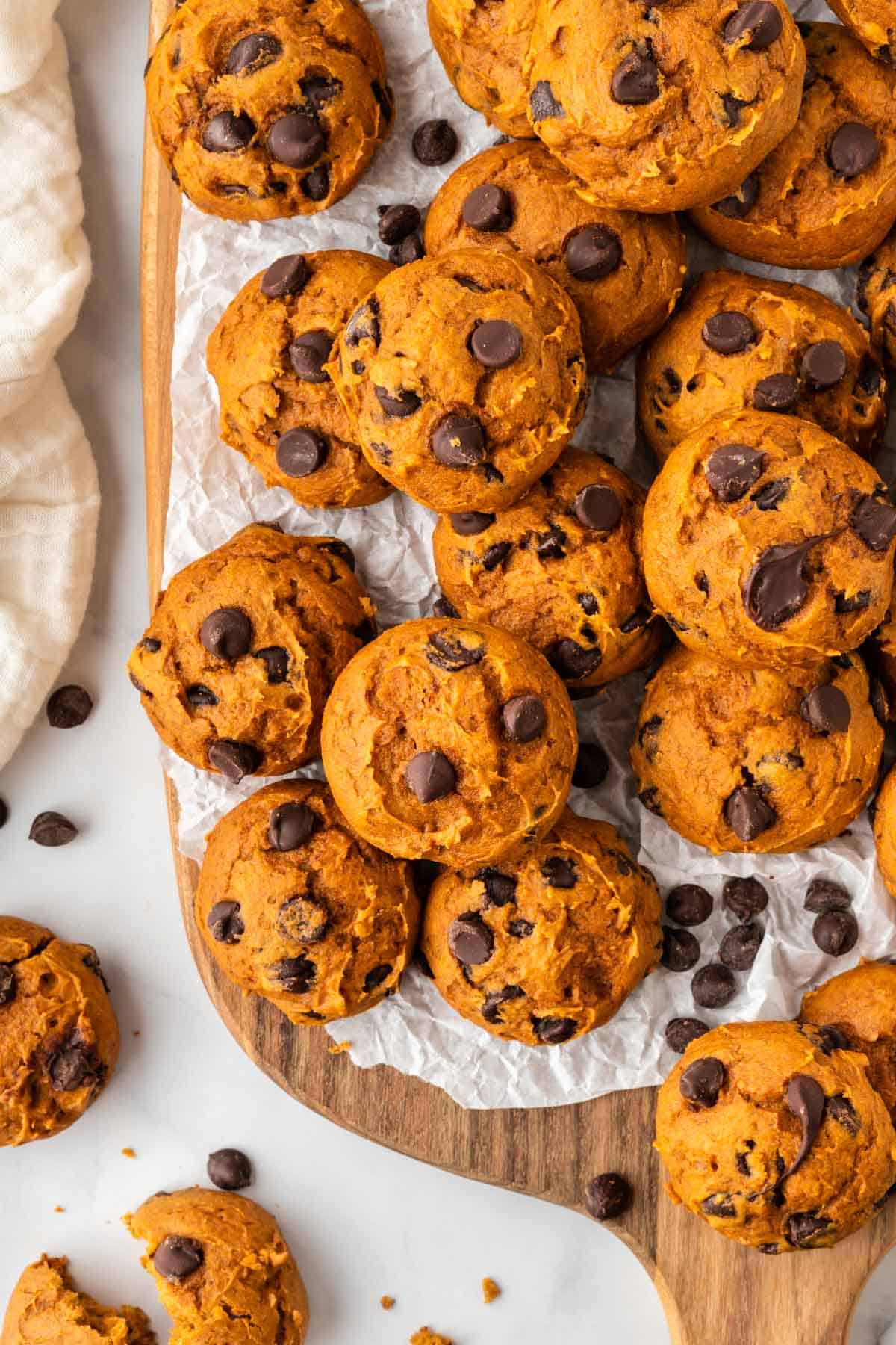 cake mix pumpkin cookies on a wooden cutting board