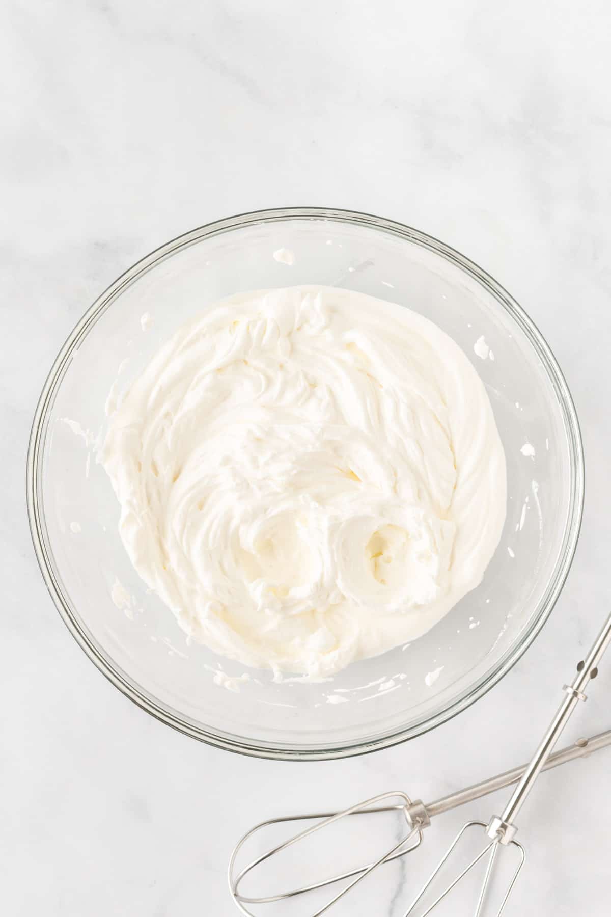 homemade whipped cream in a mixing bowl
