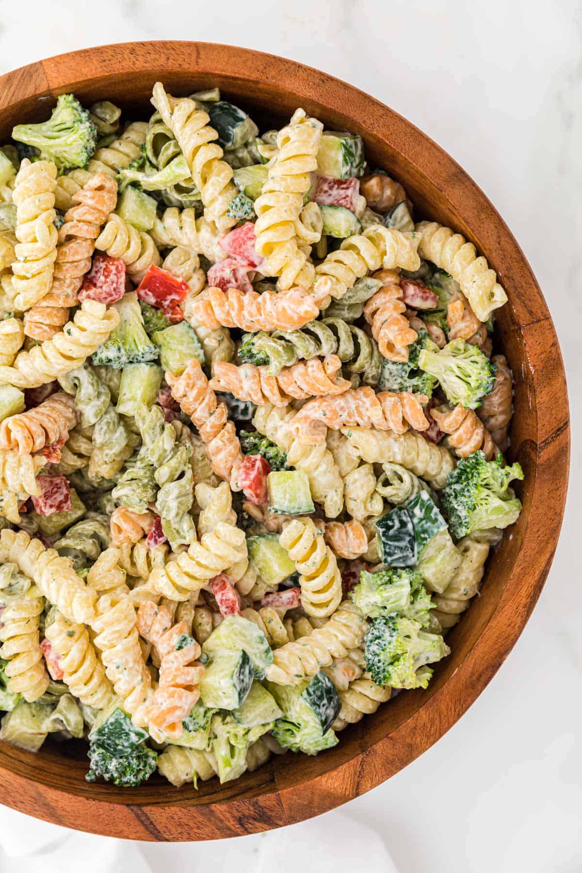 ranch pasta salad in a wooden serving bowl