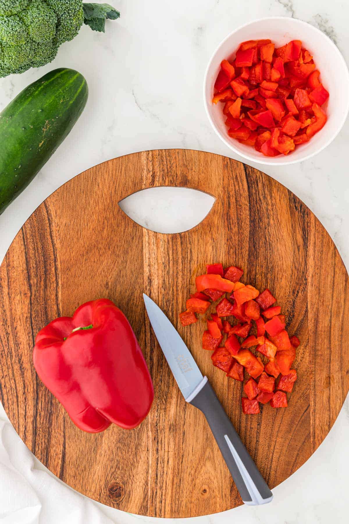 dicing up a red bell pepper