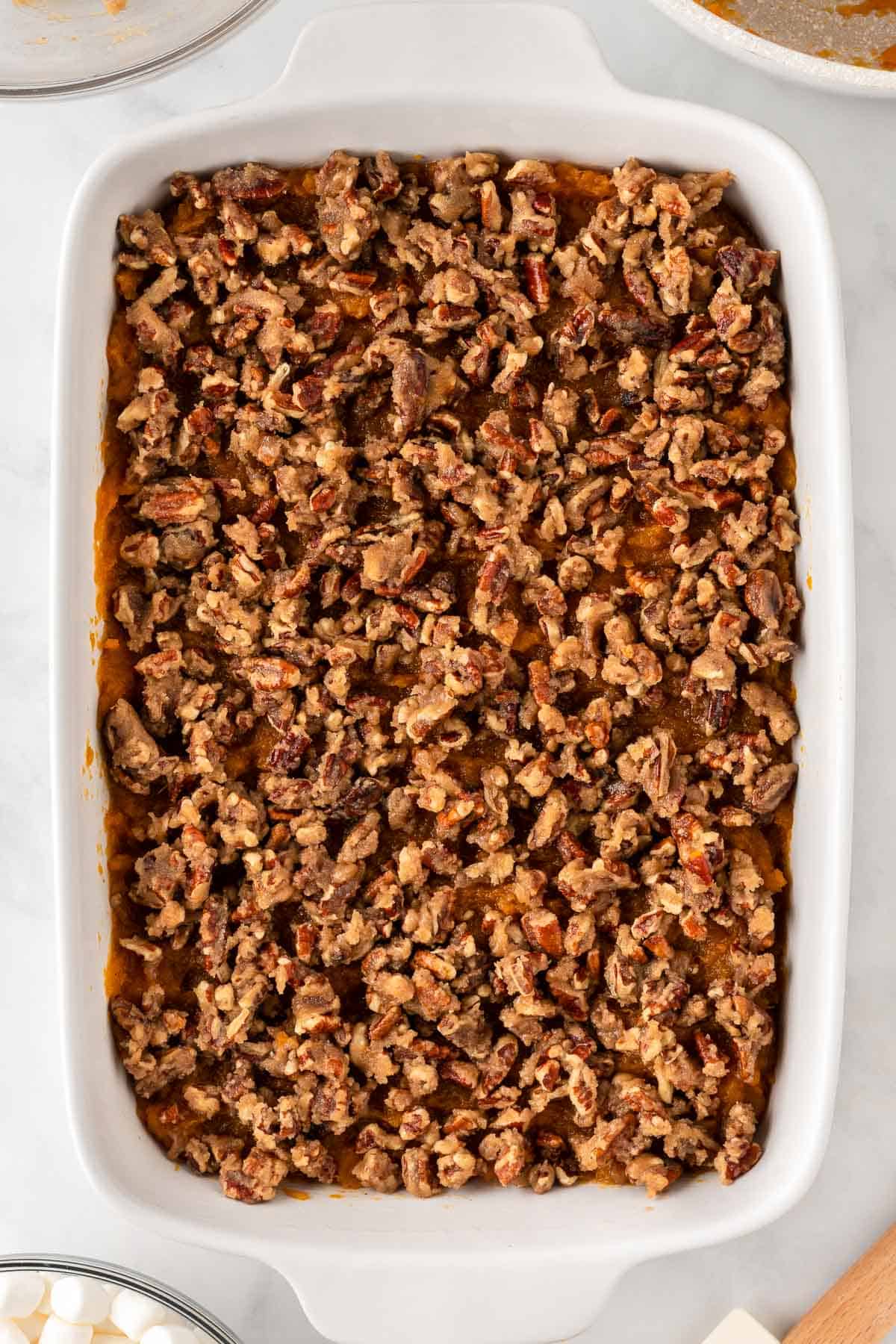 pecan crumble spread out over the sweet potato filling