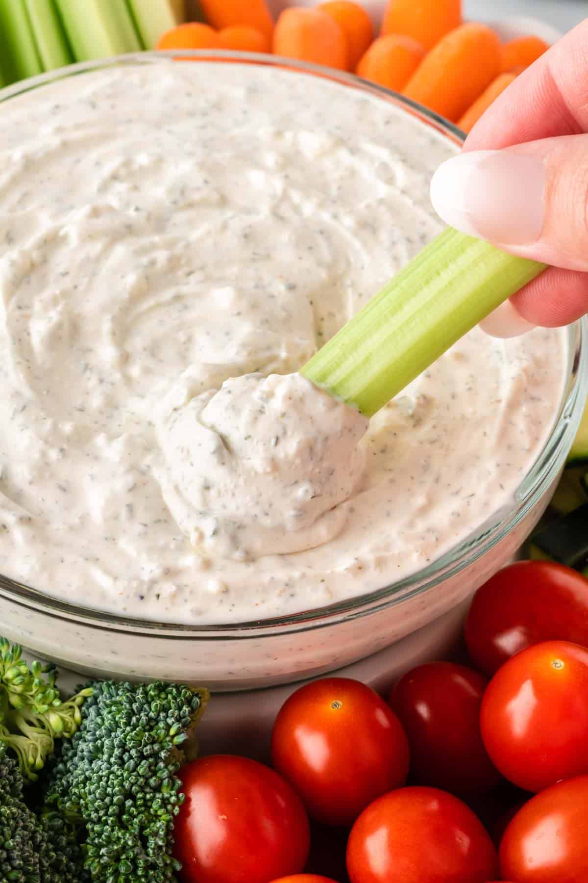 dipping celery into veggie dip