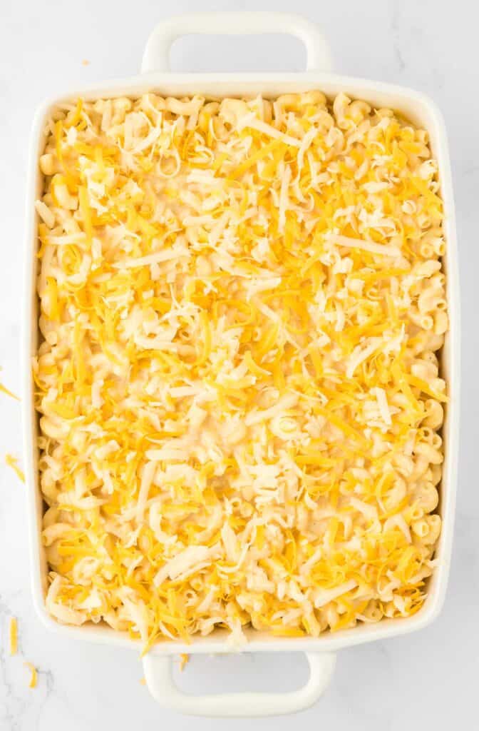 macaroni and cheese in a baking dish topped with cheese