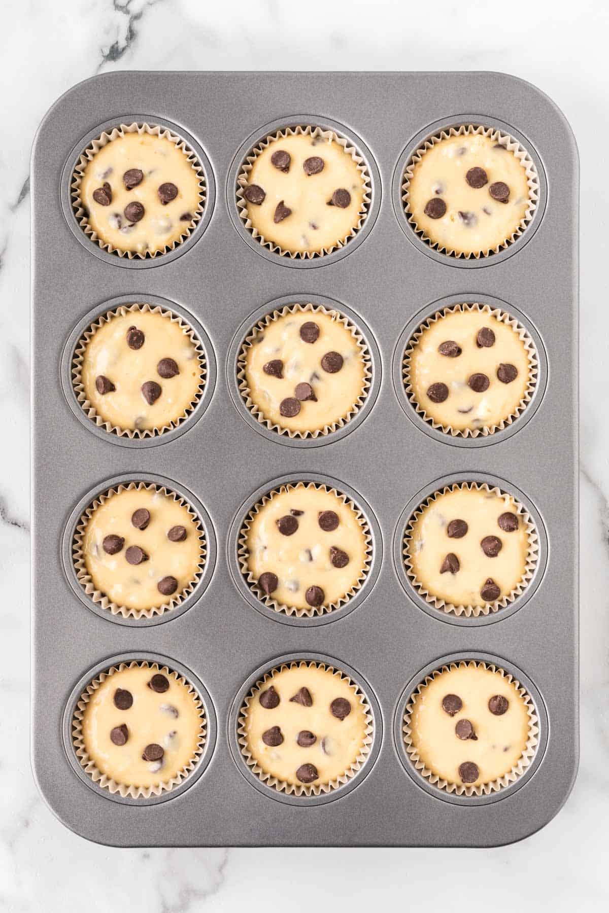 muffin tin filled with batter