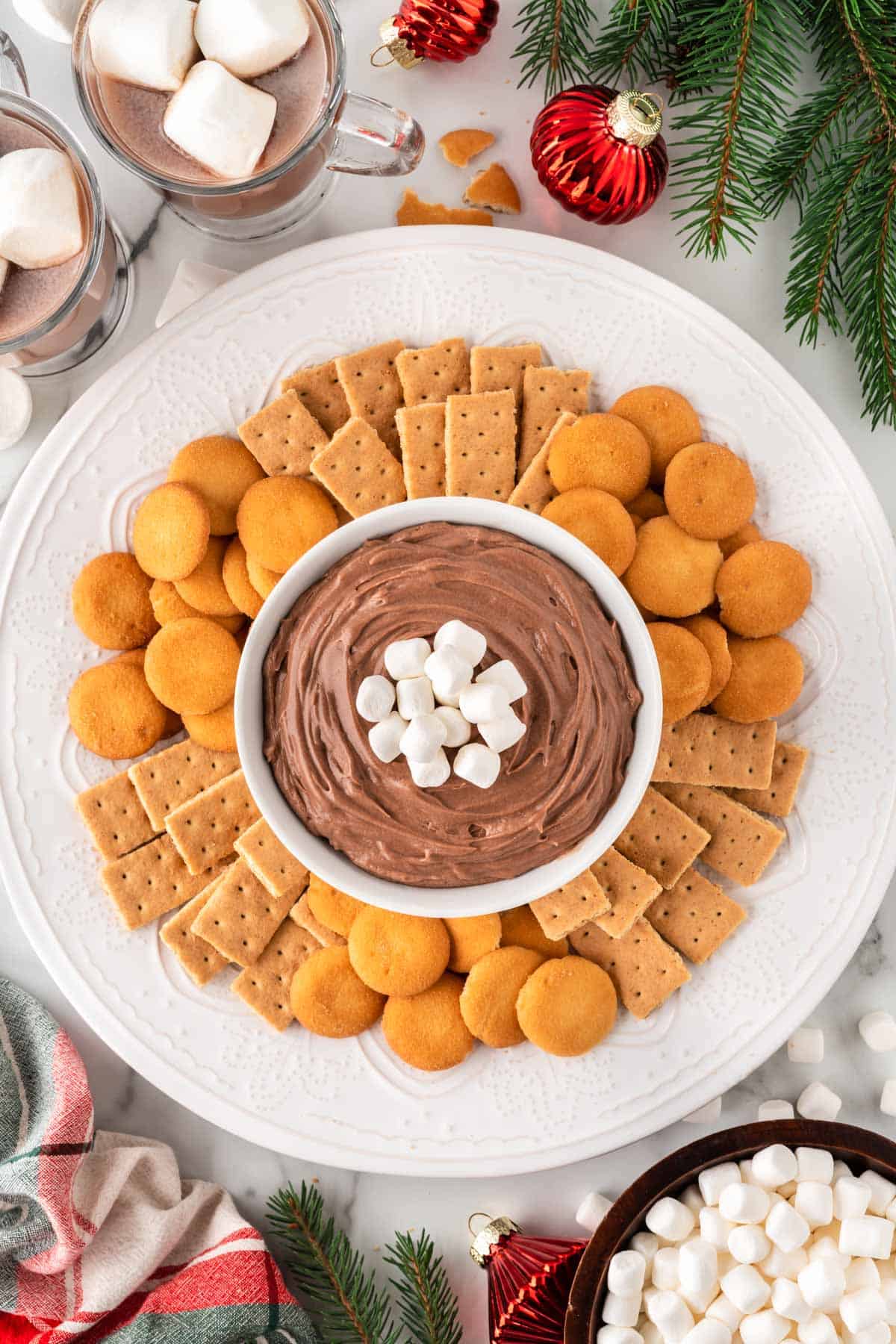 hot chocolate dip on a platter with Nilla wafers and graham crackers