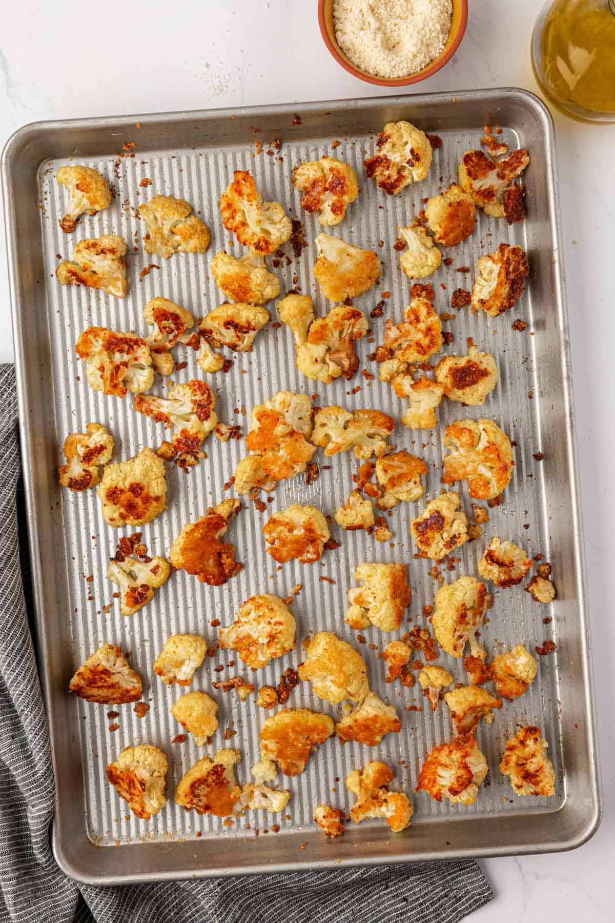 parmesan roasted cauliflower on a baking sheet
