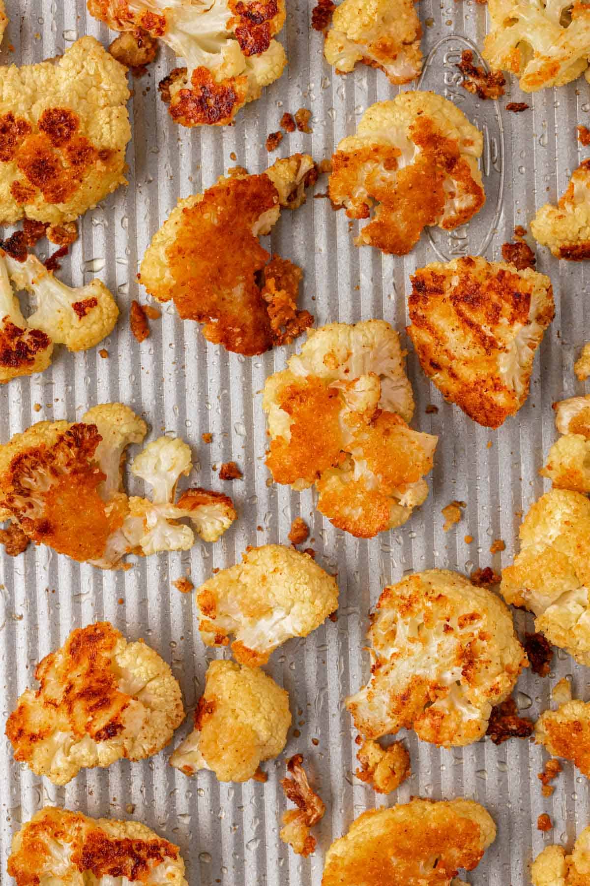 parmesan roasted cauliflower on a baking sheet