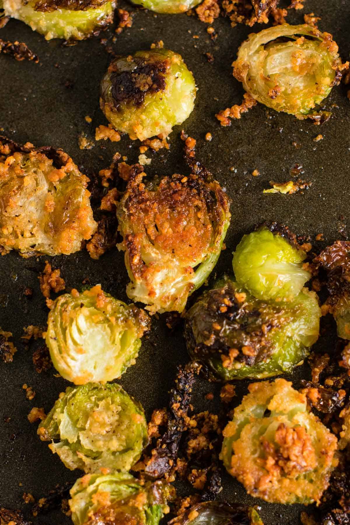 brussel sprout chips on a baking sheet