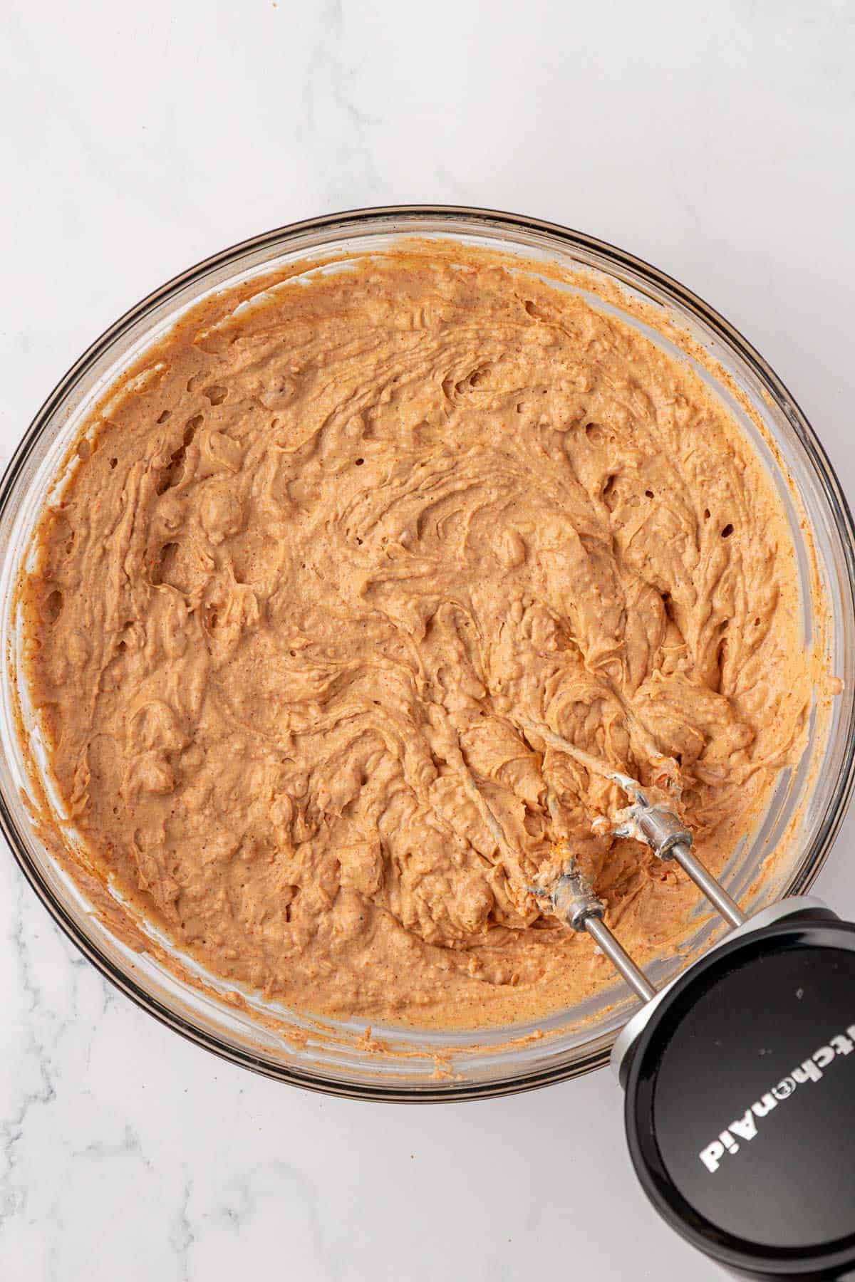 mixing the bean dip ingredients together