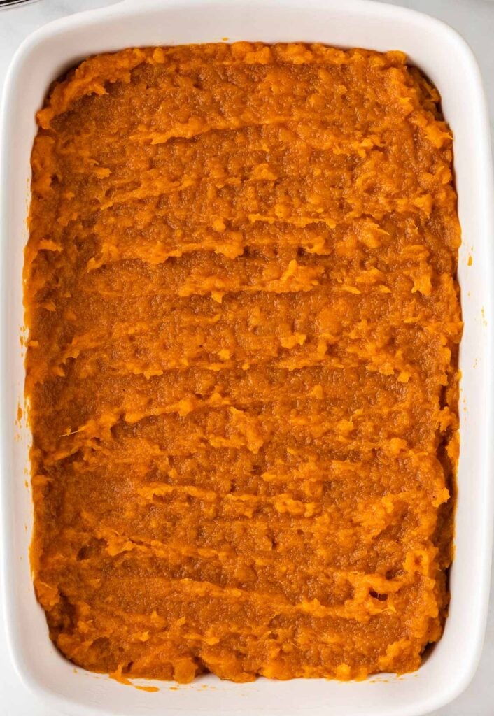 sweet potato casserole filling in a baking dish