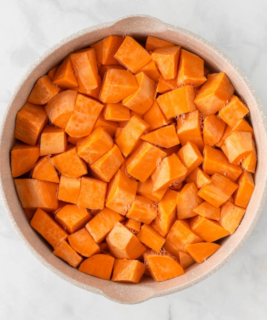 sweet potatoes being boiled in water