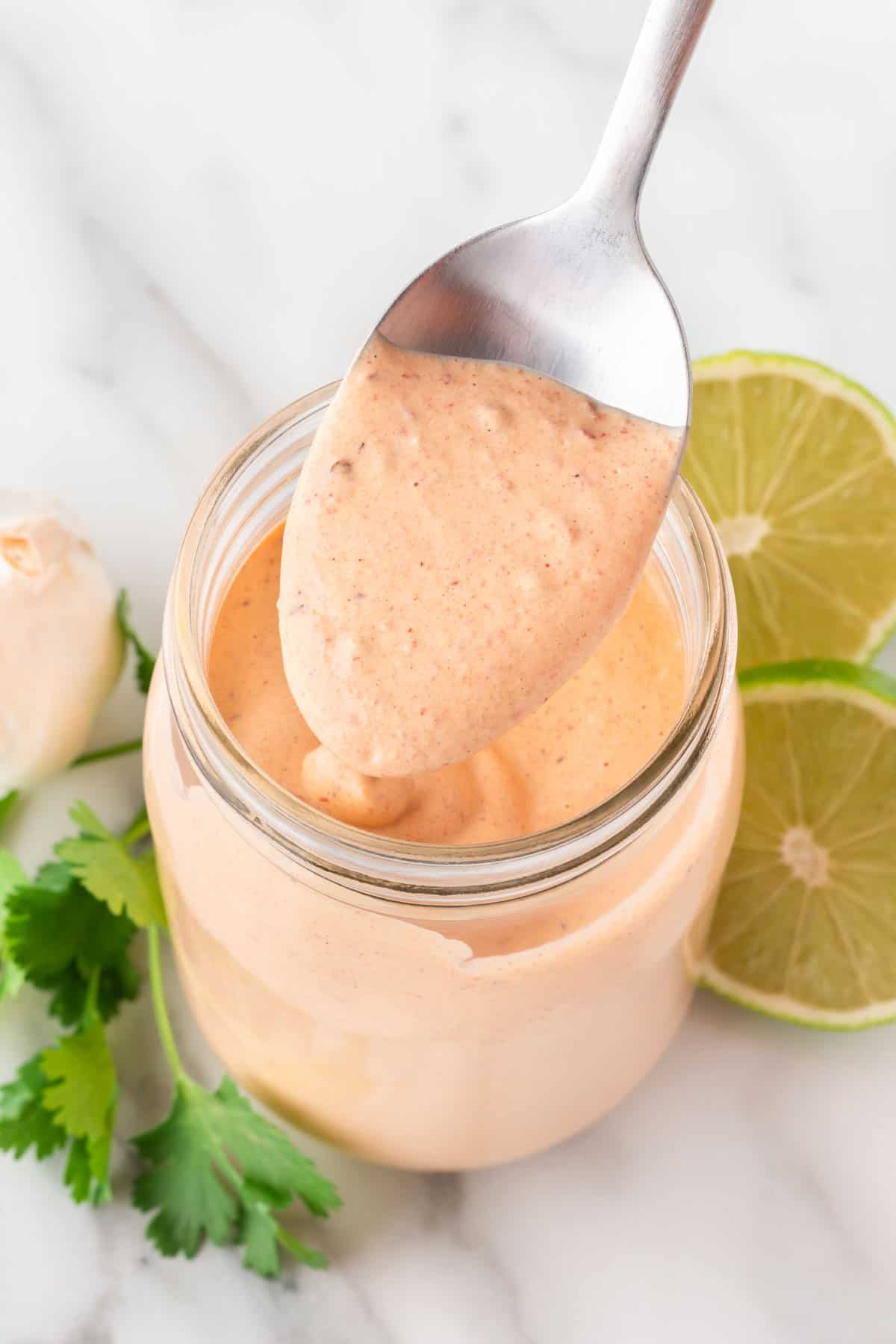 chipotle ranch dressing in a mason jar with a spoon