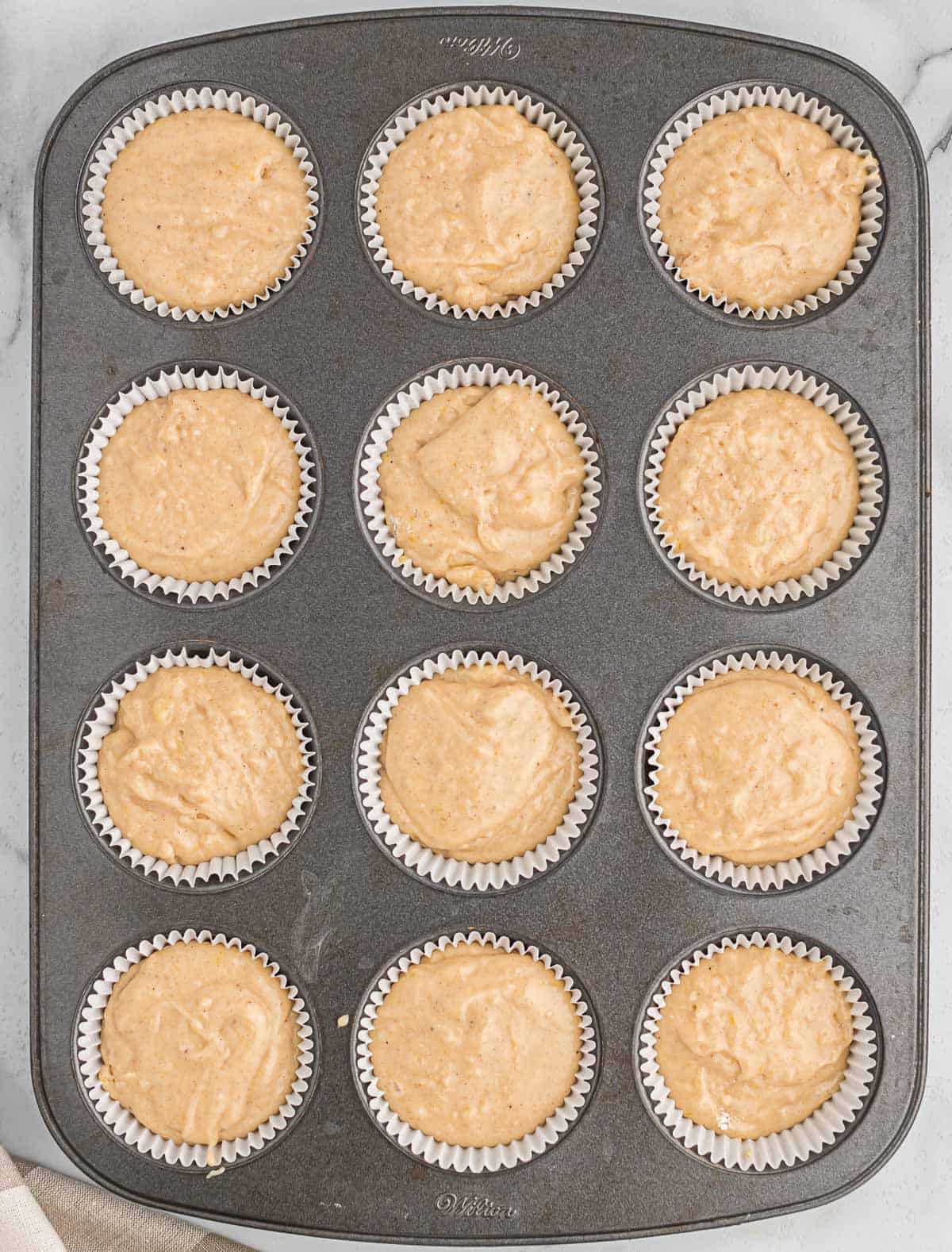eggnog muffin tin filled with batter