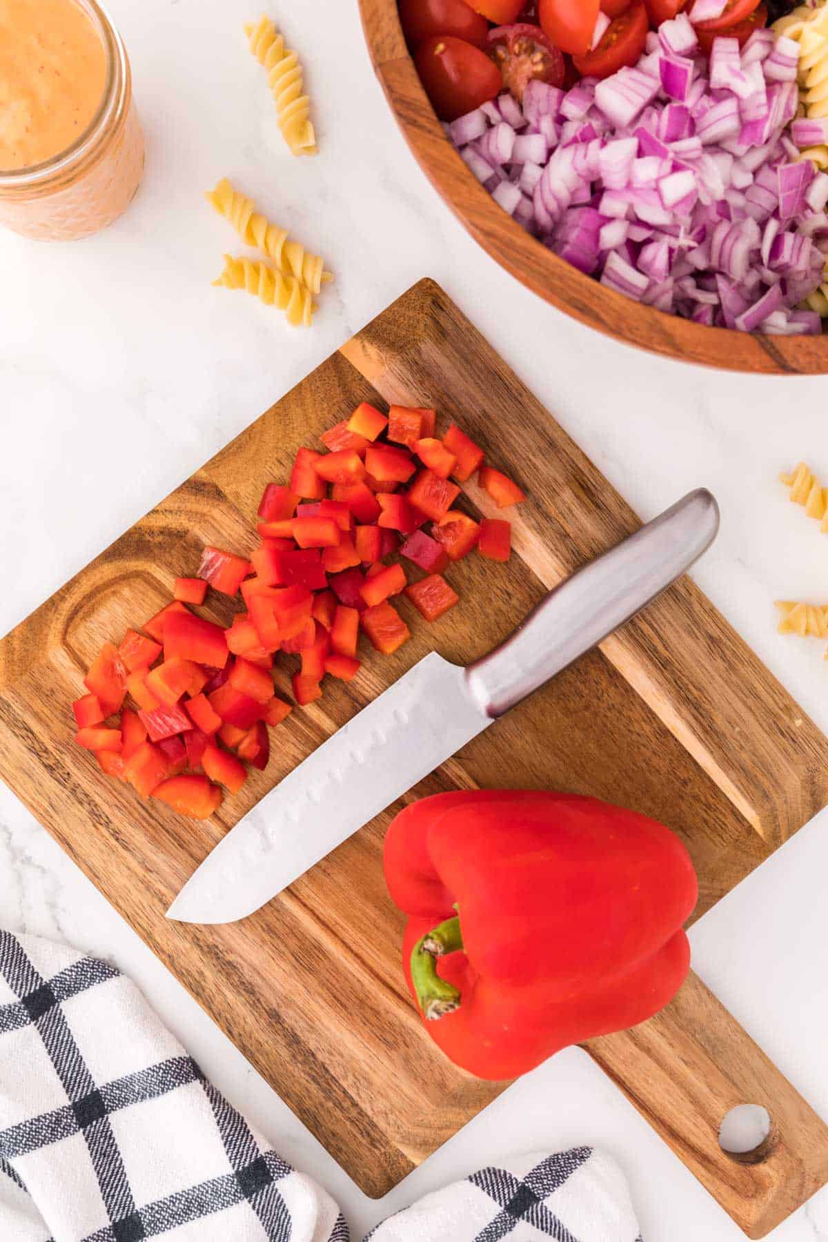 red bell pepper cut up on a cutting board