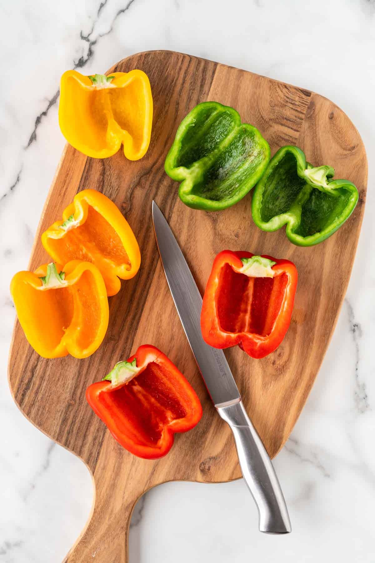 bell peppers cut open on a cutting board