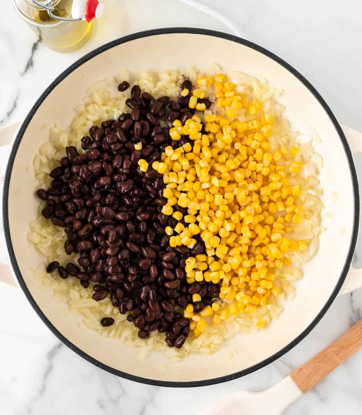 adding the black beans and corn