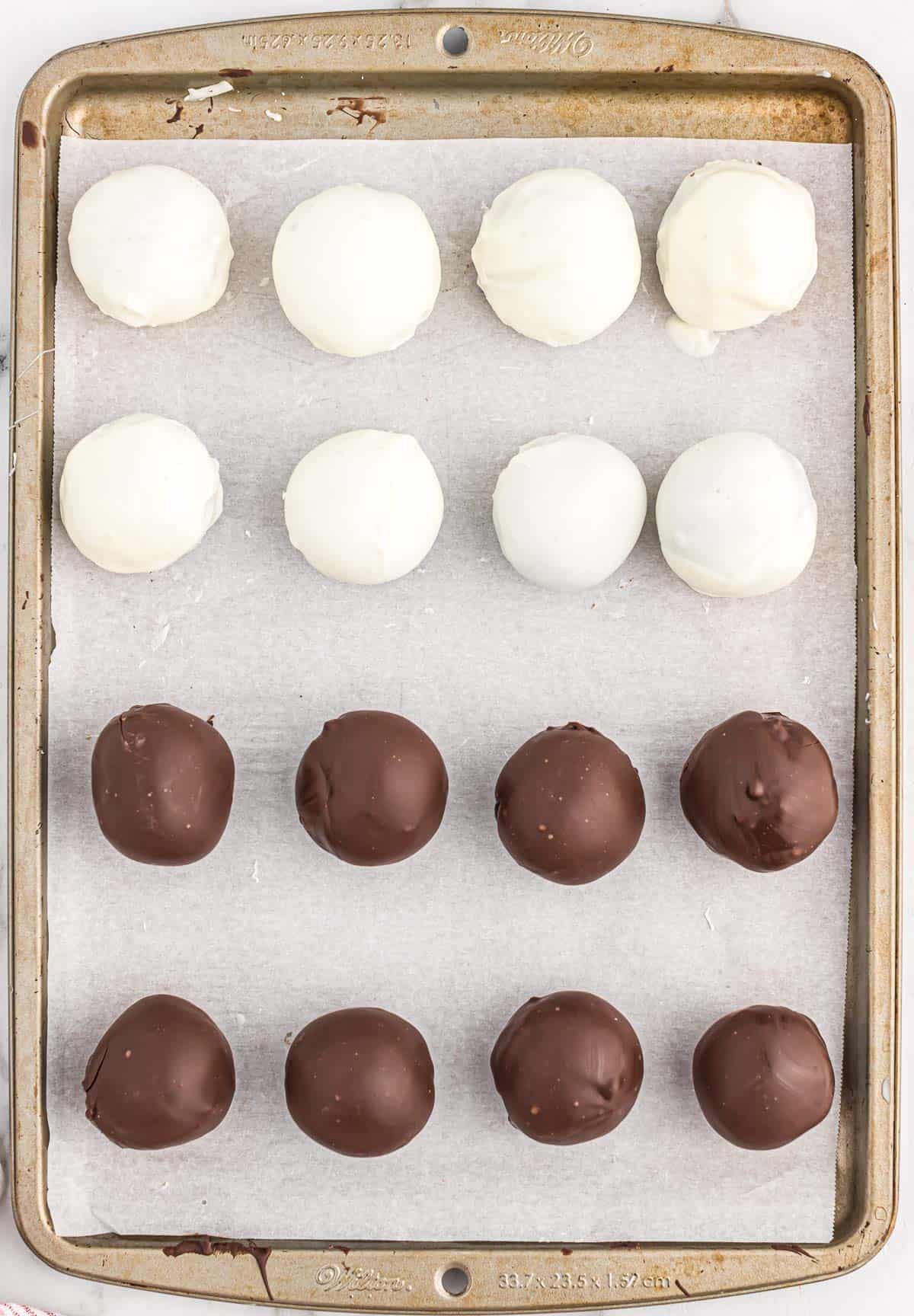 oreo balls on a lined baking sheet