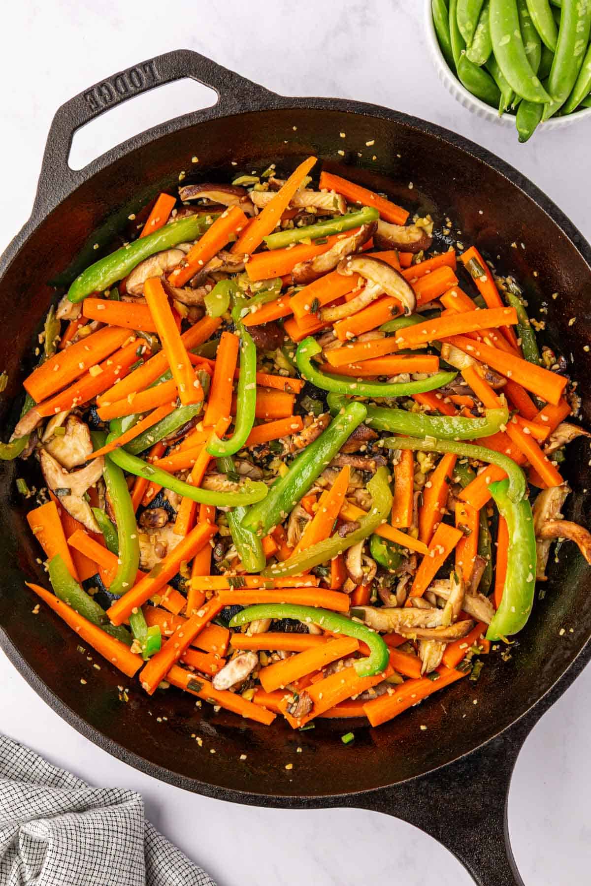 vegetables stir fried in a skillet