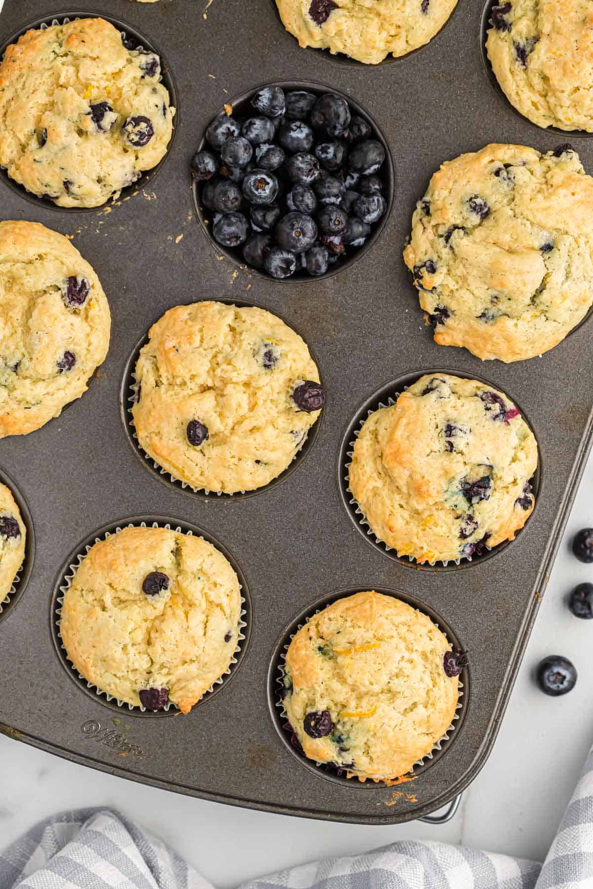 blueberry muffins in the muffin tin
