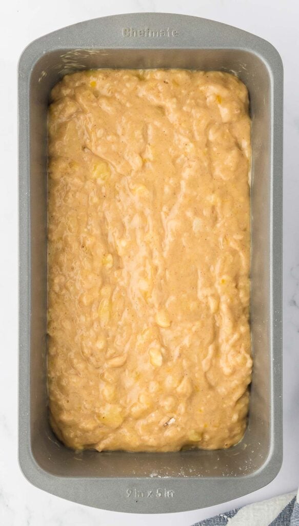 banana bread batter in a loaf pan