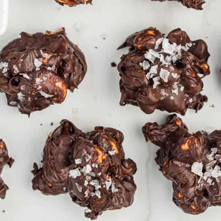 chocolate covered cashews topped with flaked sea salt