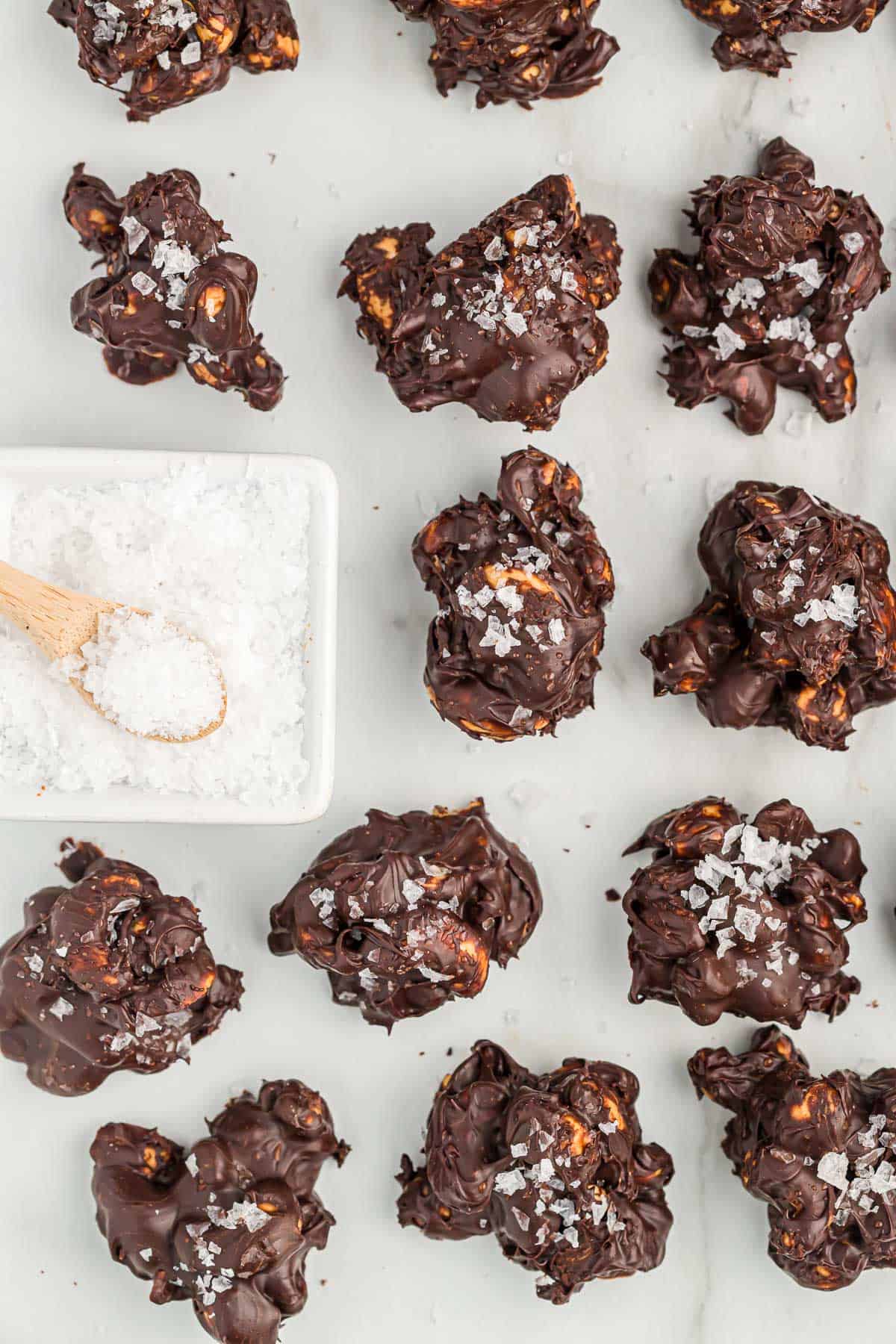 chocolate covered cashews topped with flaked sea salt