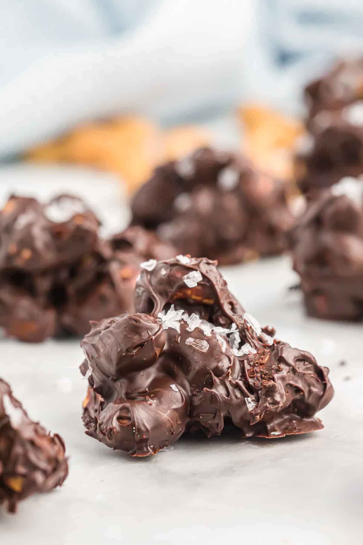 chocolate covered cashews topped with flaked sea salt