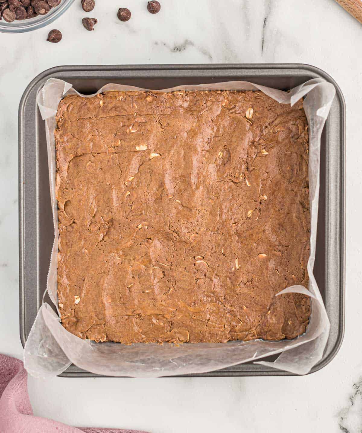 protein bars pressed into a lined baking dish