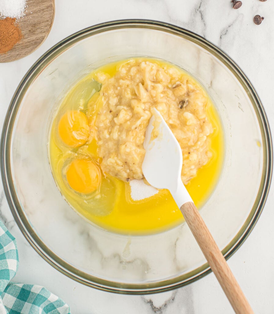 adding the wet ingredients to a mixing bowl