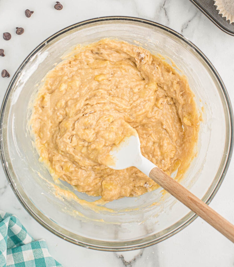 banana muffin batter mixed together in a bowl