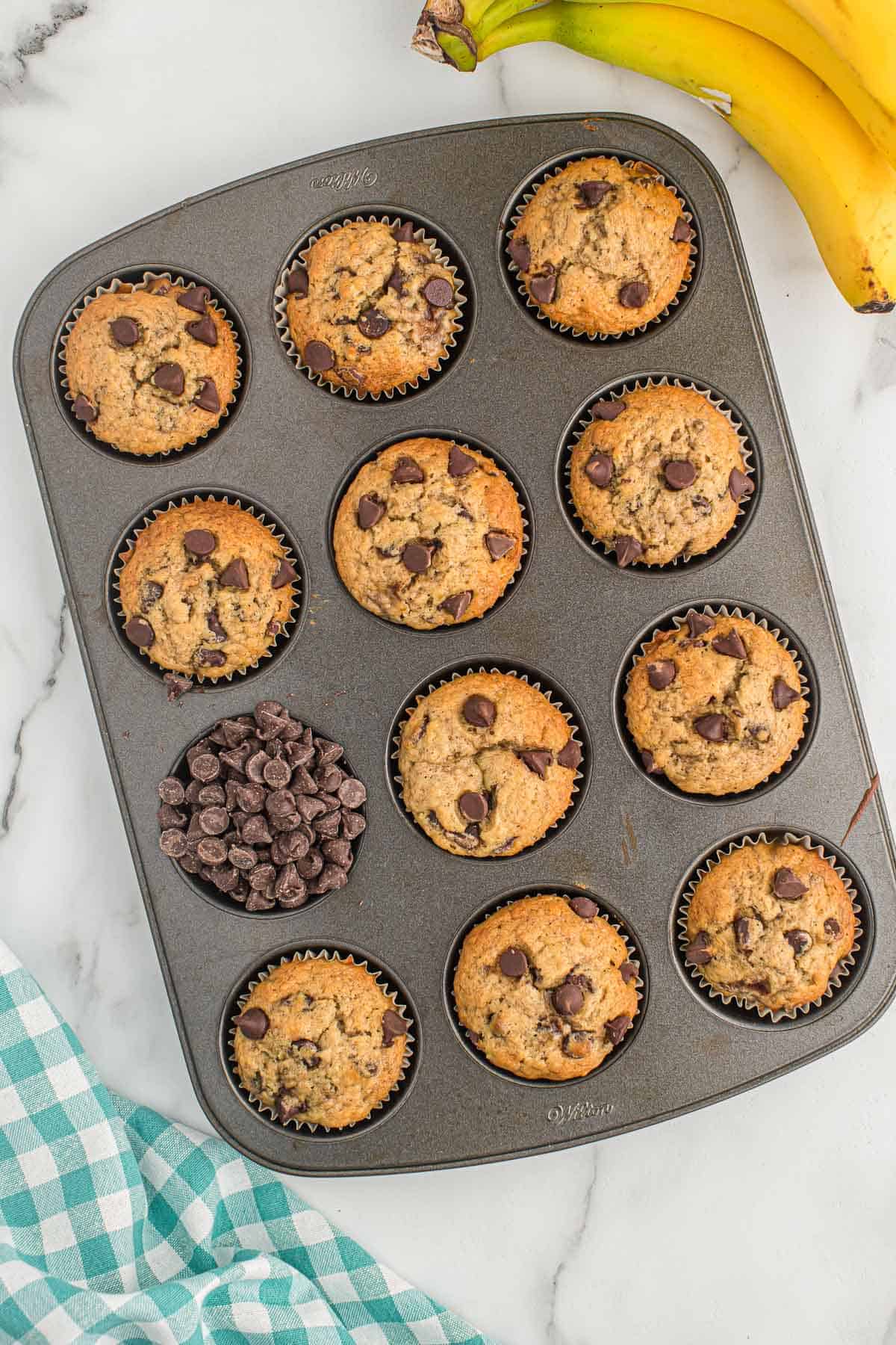 chocolate chip banana bread muffins in a muffin tin