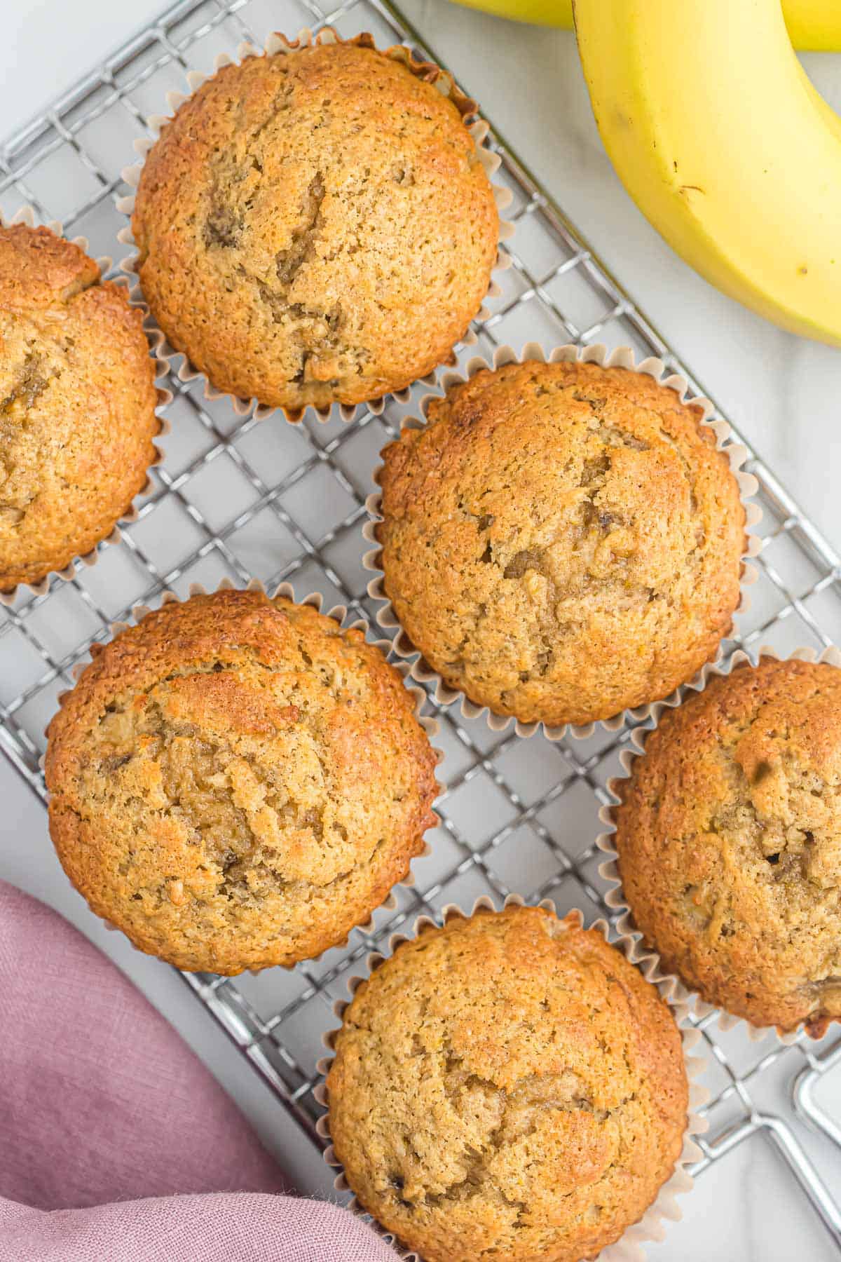 banana bread muffins on a wire cooling rack