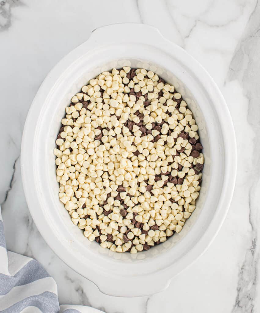 chocolate chips added to the peanuts in the slow cooker