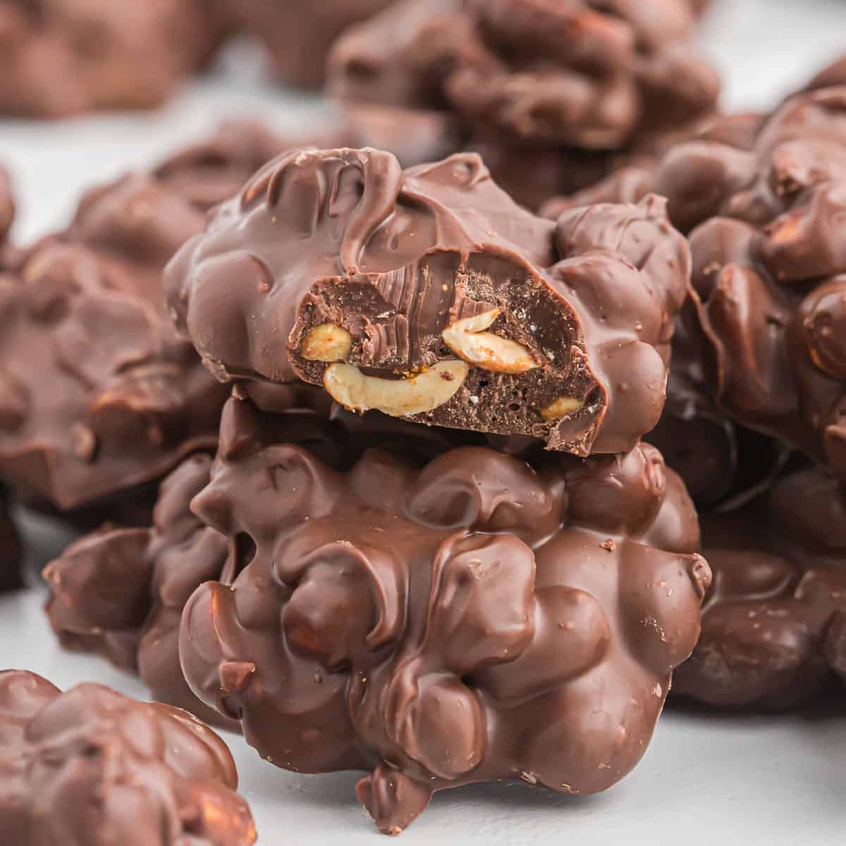 crock pot peanut cluster with a bite taken out