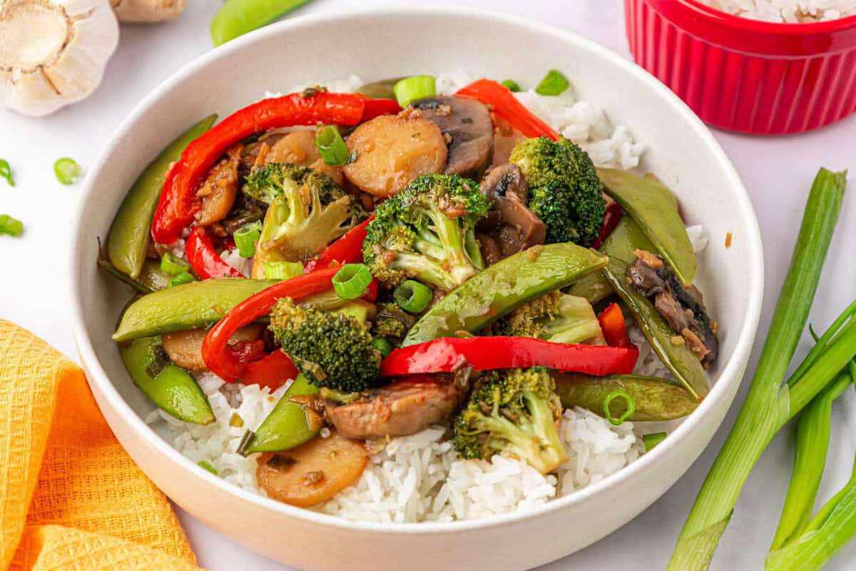 vegetable stir fry over rice in a bowl