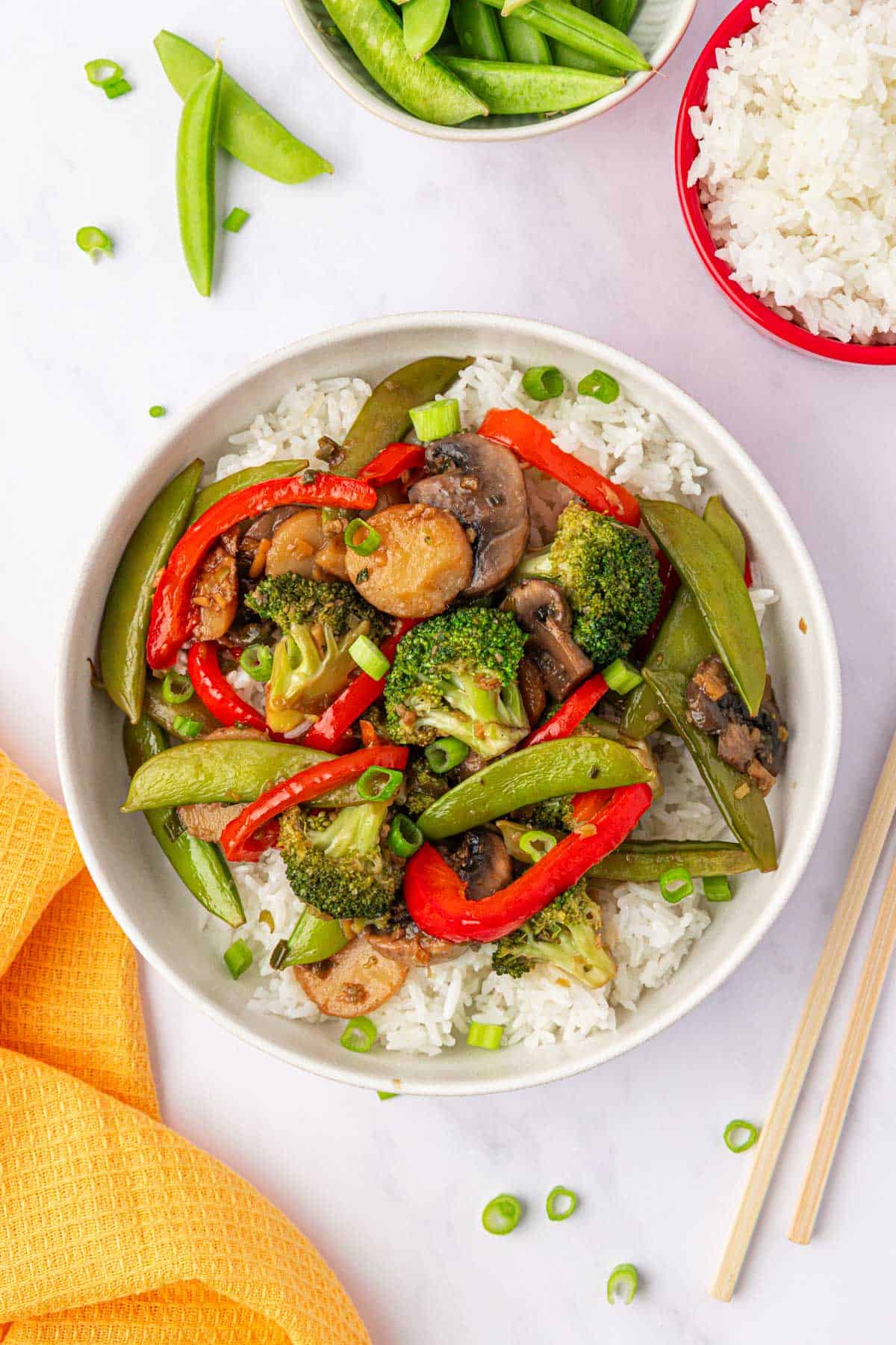 vegetable stir fry over rice in a bowl