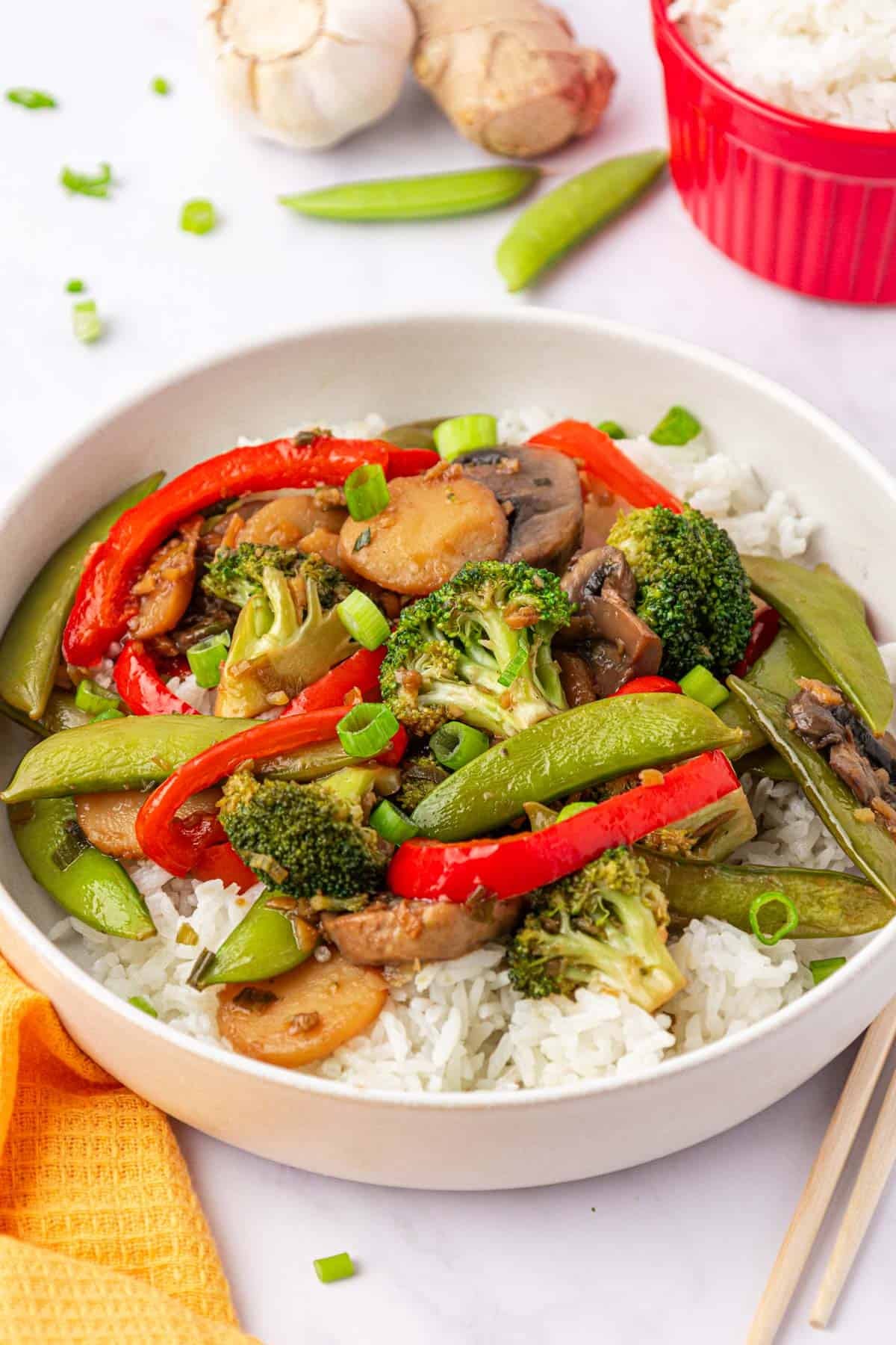 stir fry vegetables over rice in a bowl